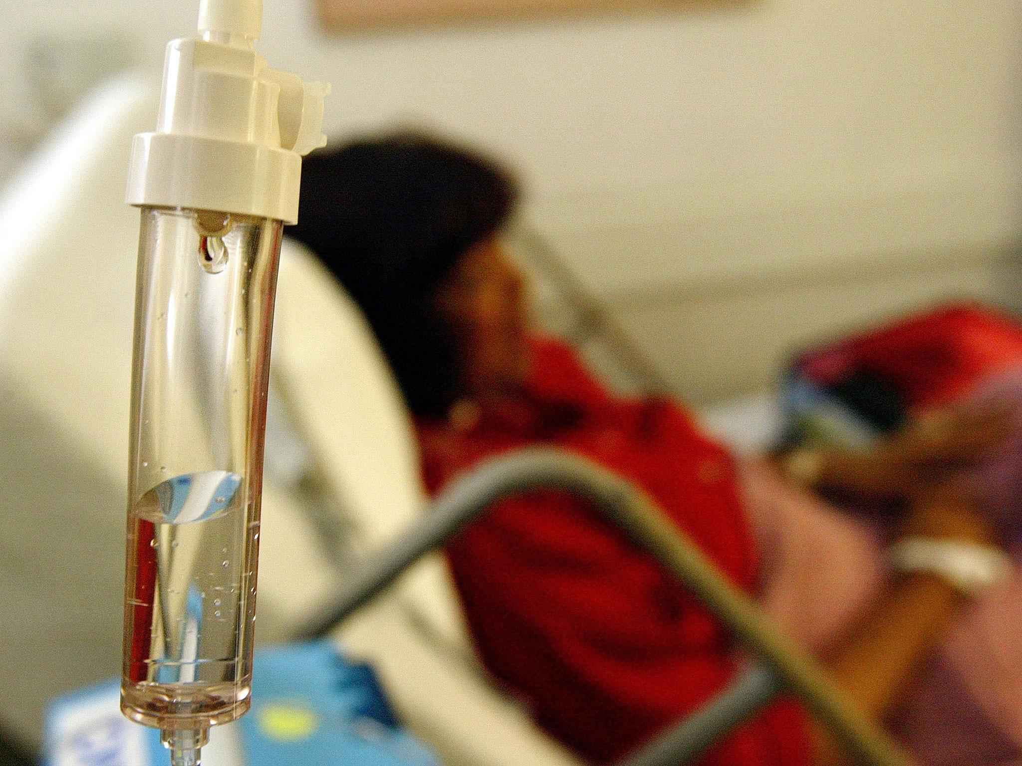 A breast cancer patient receives a chemotherapy drip at Cape Fear Valley Medical Center June 17, 2003 in Fayetteville, North Carolina. Innovations in cancer treatment, such as more precise doses for chemotherapy drugs and high-tech radiation machines, are making the treatment of the disease more effective than ever.