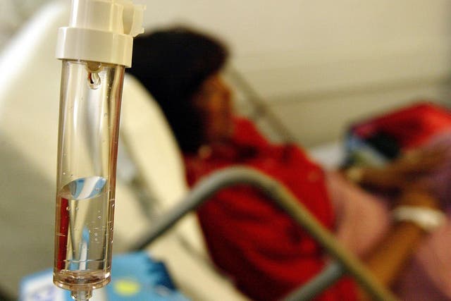 A breast cancer patient receives a chemotherapy drip at Cape Fear Valley Medical Center June 17, 2003 in Fayetteville, North Carolina. Innovations in cancer treatment, such as more precise doses for chemotherapy drugs and high-tech radiation machines, are making the treatment of the disease more effective than ever.