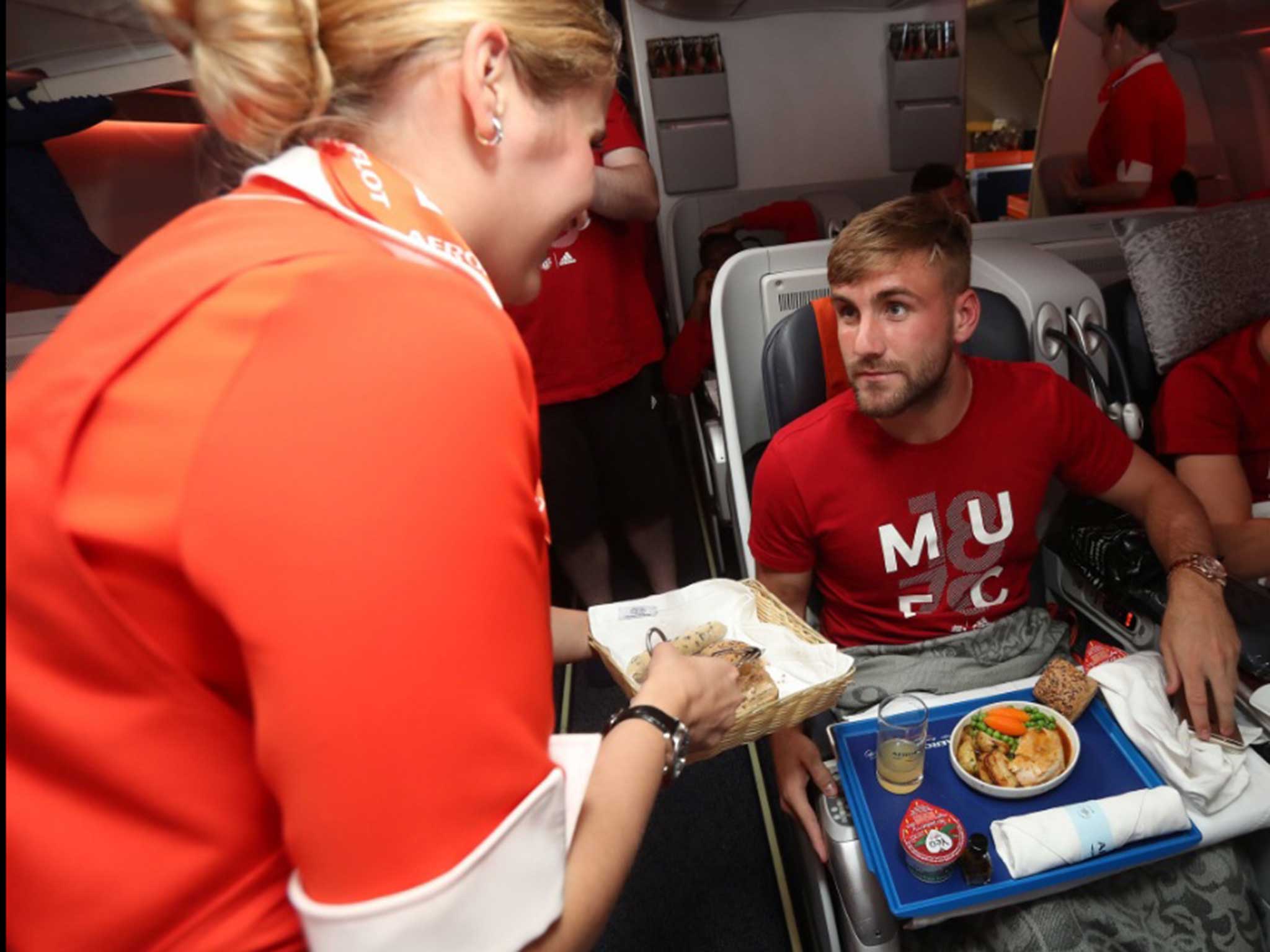Luke Shaw and his Manchester United team-mates return home on Tuesday morning