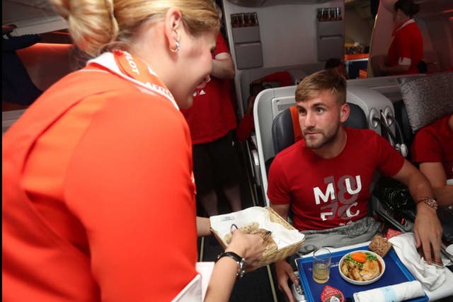 Luke Shaw and his Manchester United team-mates return home on Tuesday morning