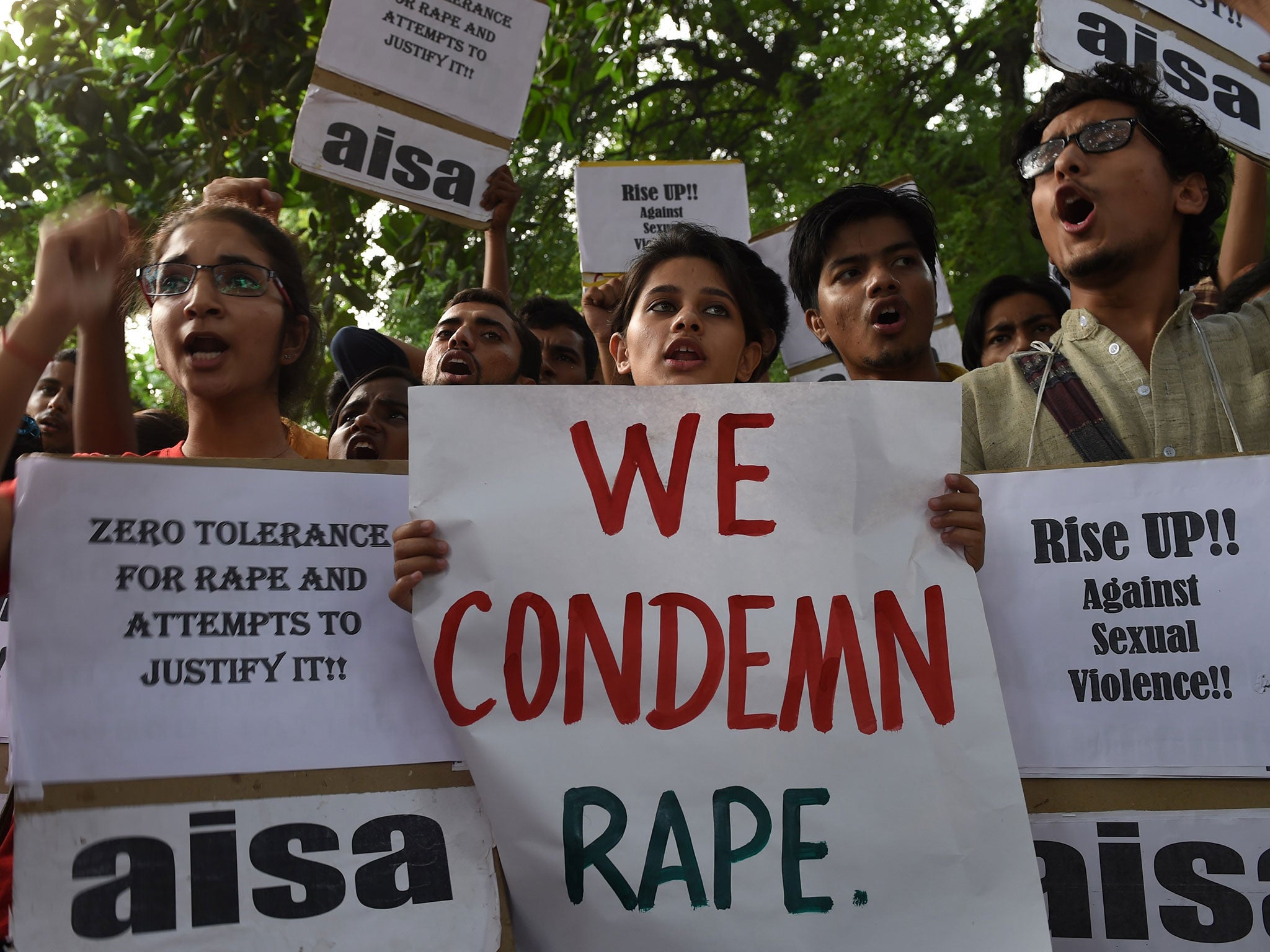 Indian students shout slogans during a protest against the rapes of two minor girls outside the police headquarters in New Delhi on October 18, 2015
