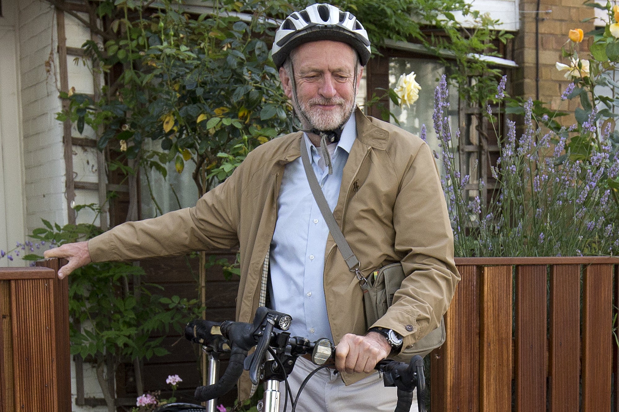Jeremy Corbyn leaves his home by bicycle on Wednesday in London