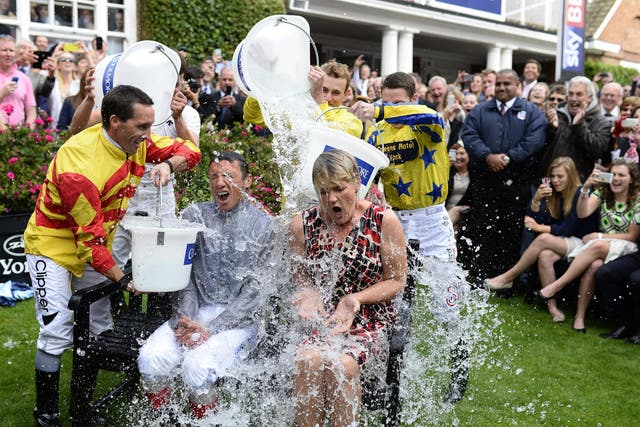 Frankie Dettori and Clare Balding take part in the ‘Ice Bucket Challenge’ at York racecourse on August 22, 2014.