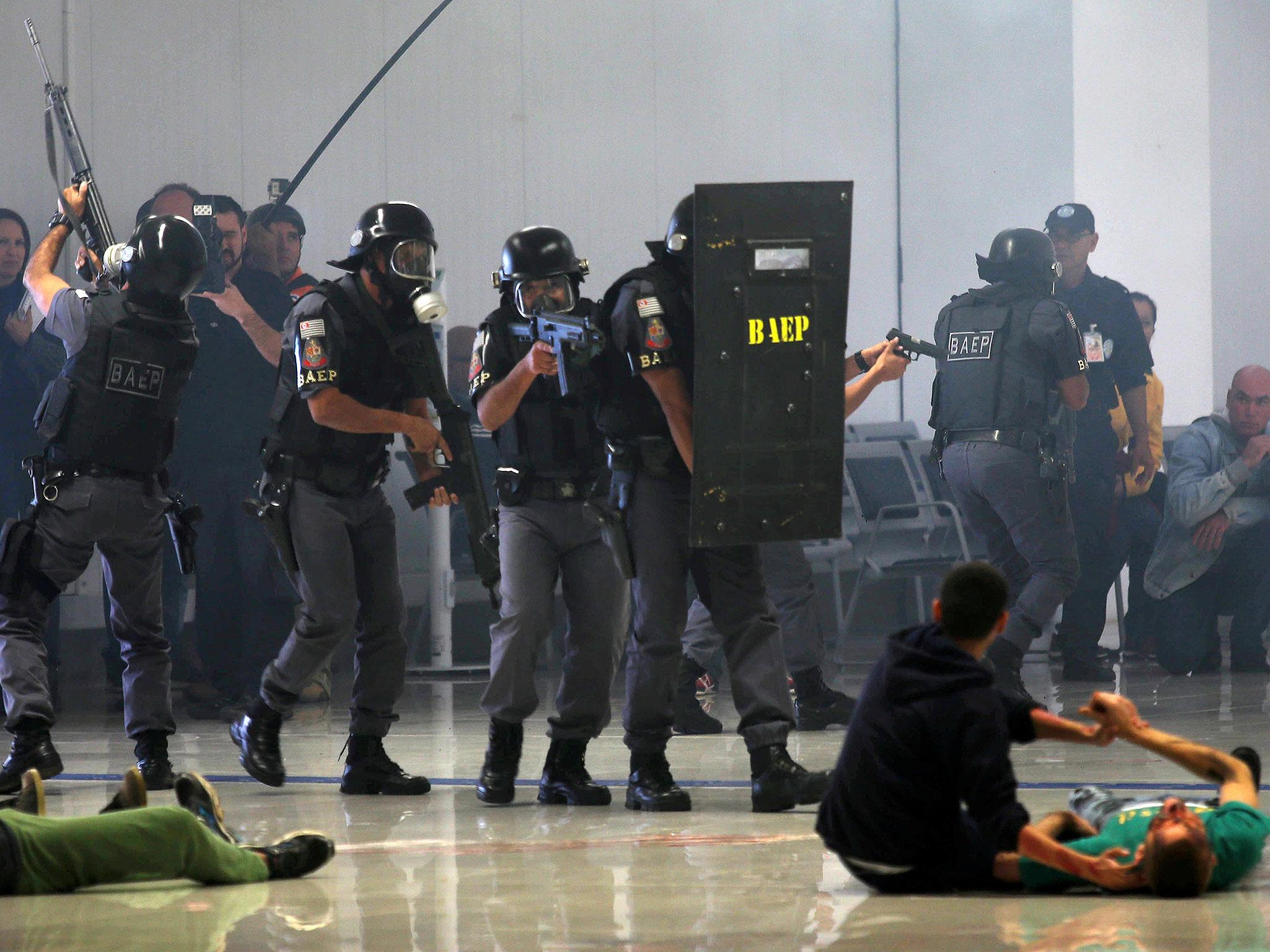 Sao Paulo state police take part in a simulated hostage situation during a security exercise ahead of the 2016 Rio Olympics