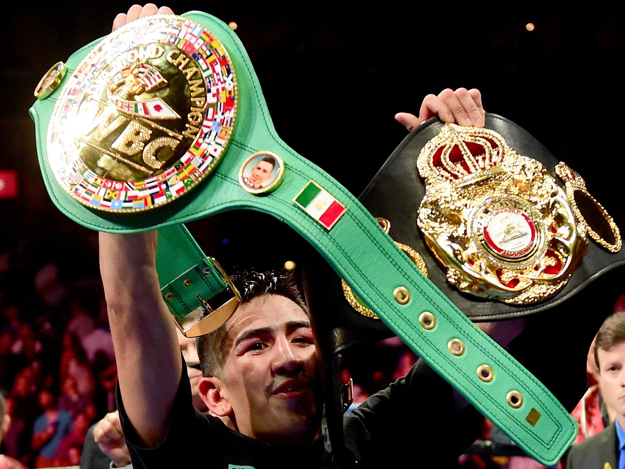 Santa Cruz with his two belts after beating Abner Mares