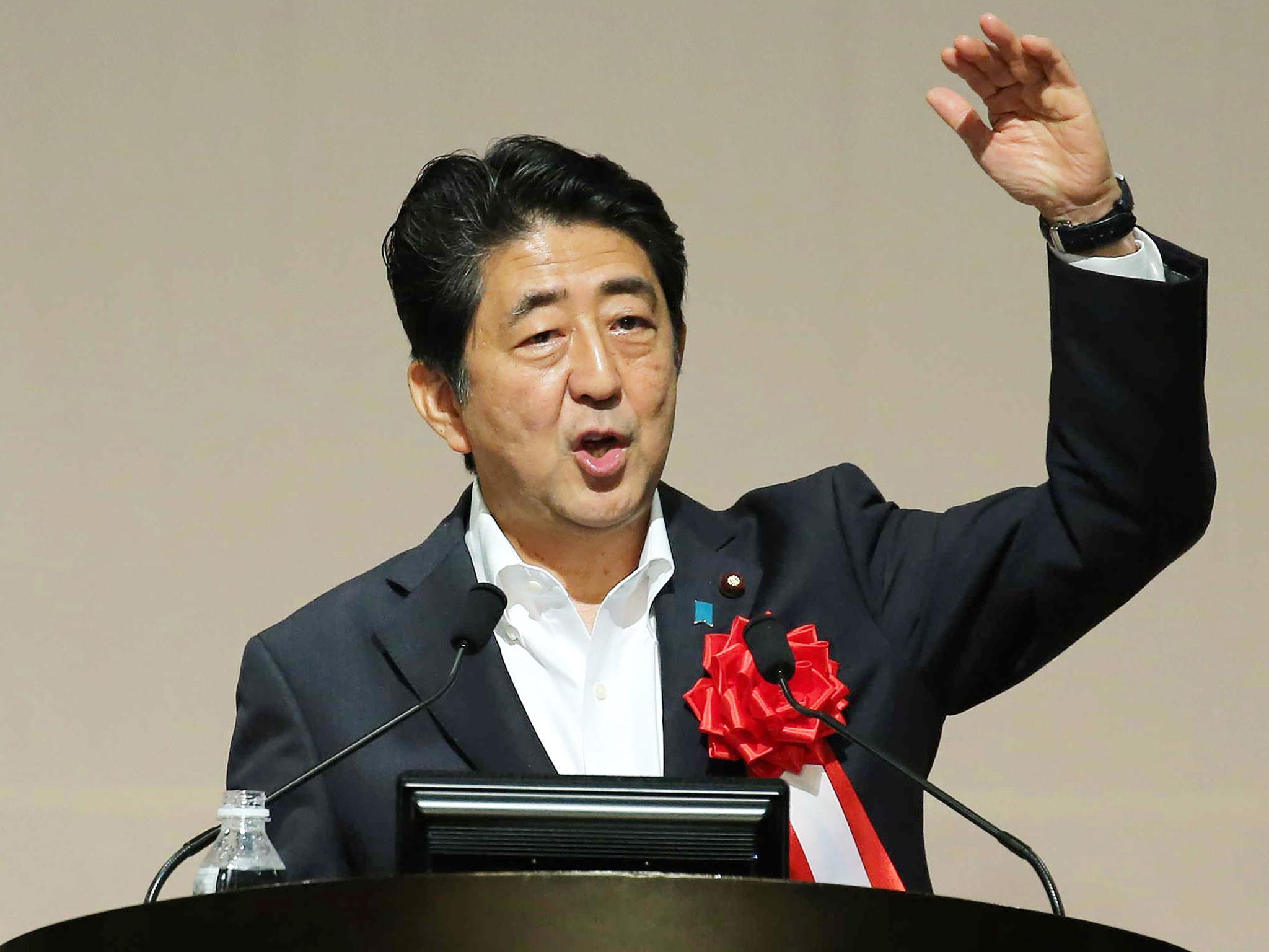 Japanese Prime Minister Shinzo Abe appears to be celebrating Donald Trump's victory