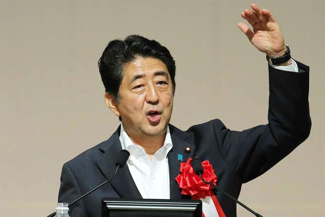 Japanese Prime Minister Shinzo Abe appears to be celebrating Donald Trump's victory