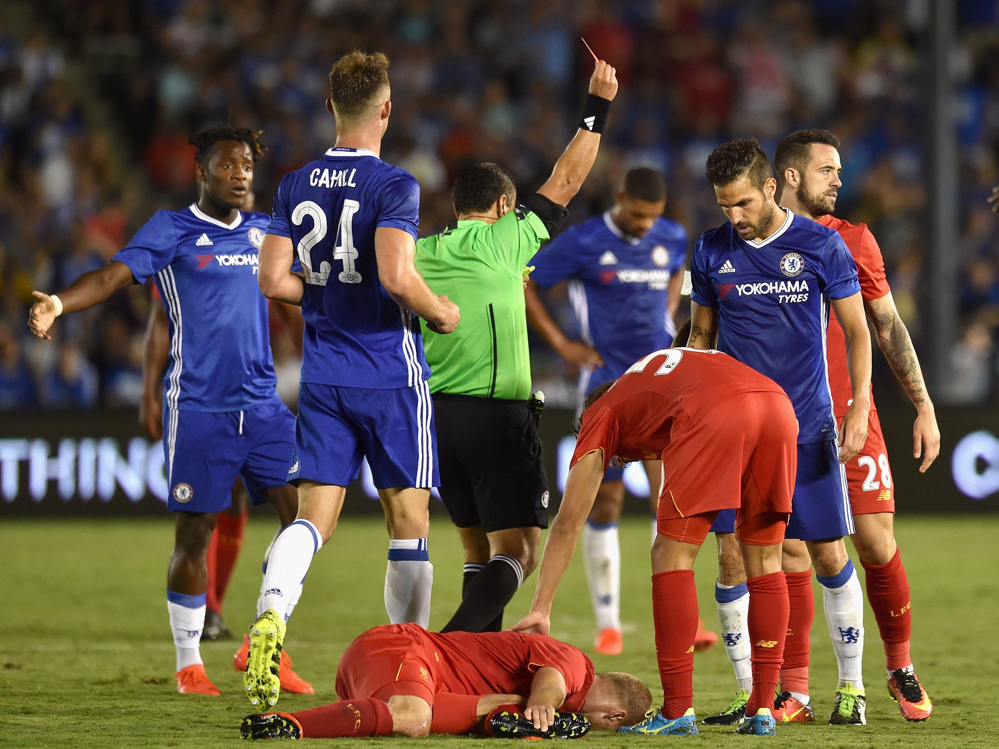 Cesc Fabregas is shown a red card during Chelsea's pre-season victory over Liverpool in Los Angeles