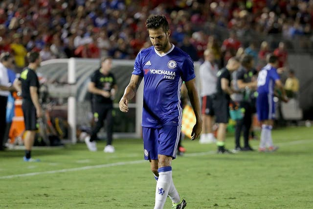 Cesc Fabregas leaves the field at the Rose Bowl after his dismissal in LA