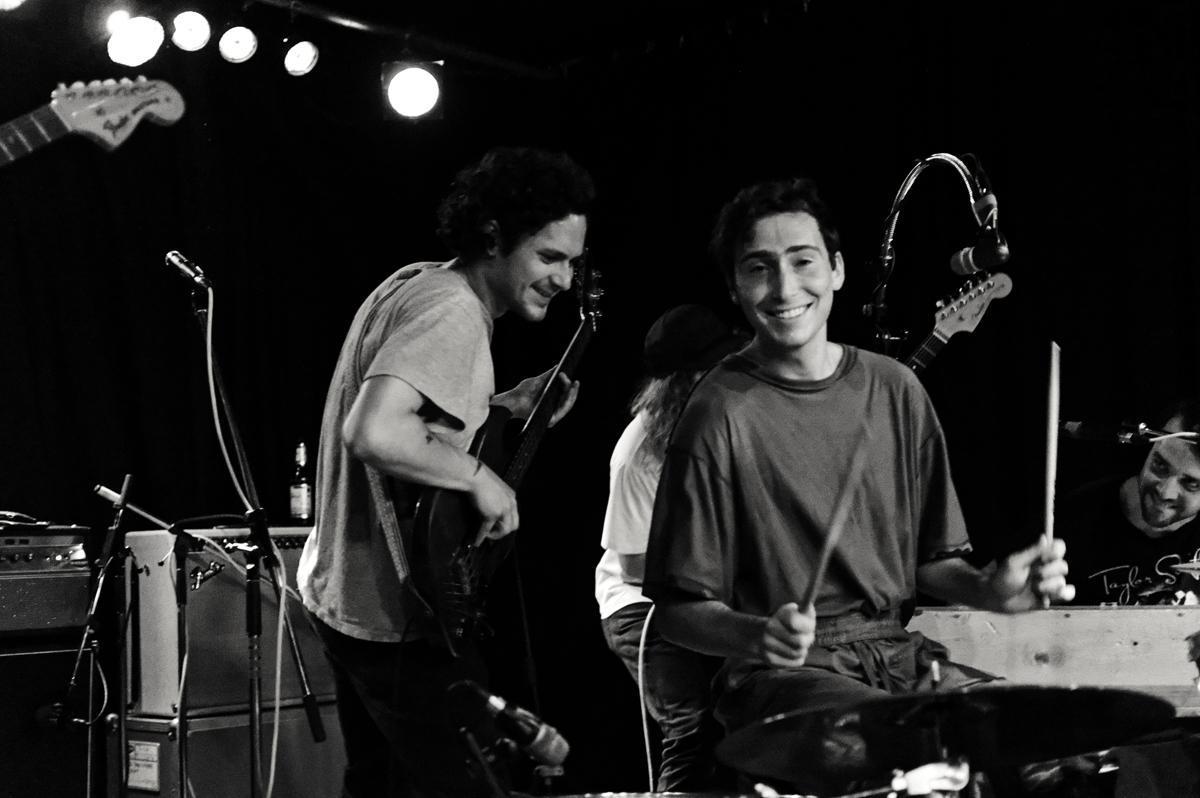 Lead vocalist and drummer Julien Ehrlich (right) gets ready for a gig on Whitney’s European tour