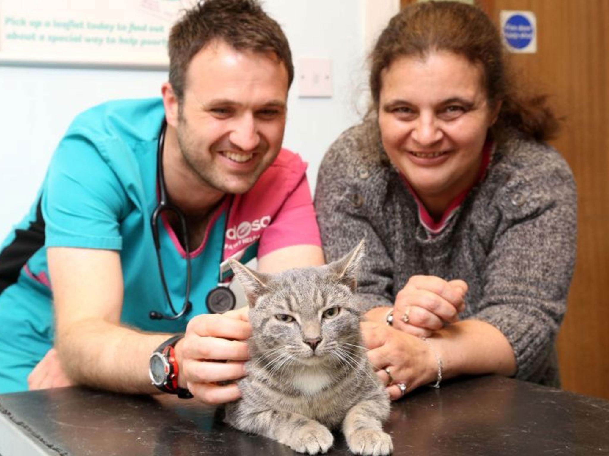 Bobby with his owner Lisa Keefe and PDSA vet James Kellow