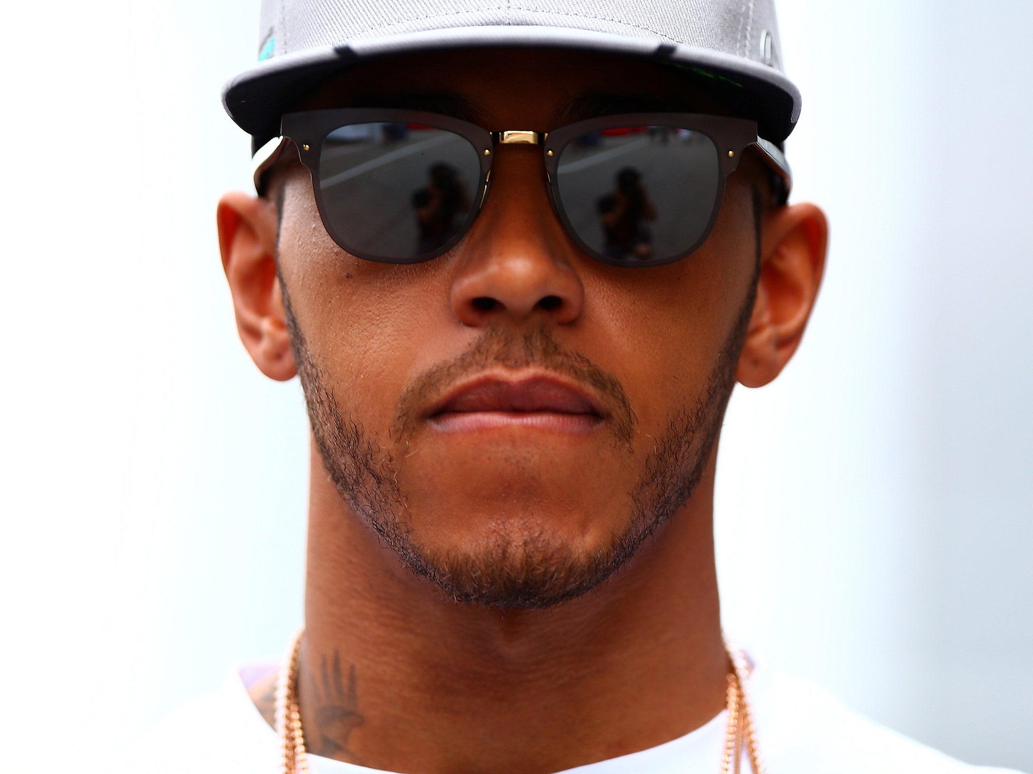 Lewis Hamilton has come under fire after posing on Snapchat with tigers