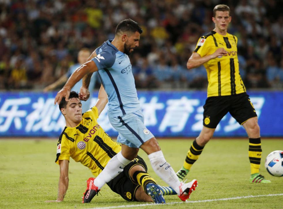 Sergio Aguero scores Manchester City's opener against Borussia Dortmund