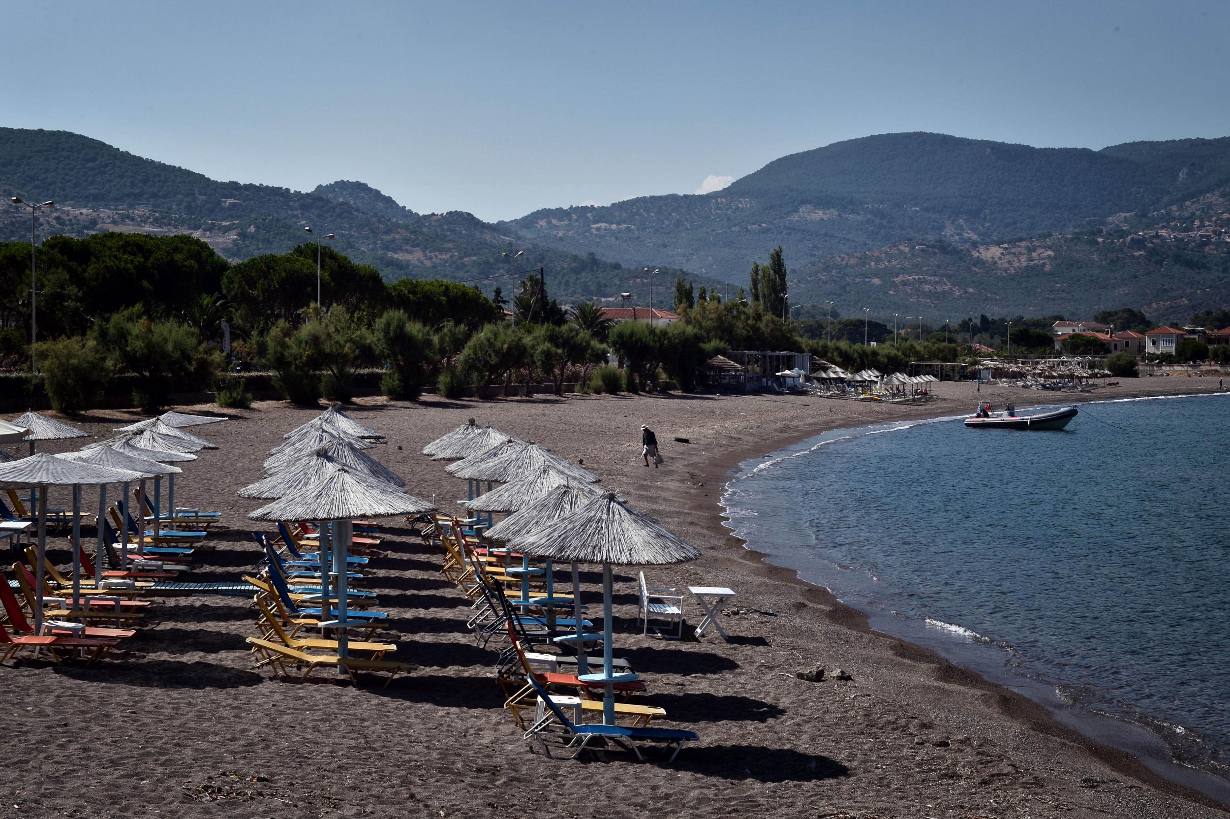 Sunbeds near the village of Molyvos on Lesbos last month. A year ago, before the refugee crisis, this beach would have been crowded with holidaymakers