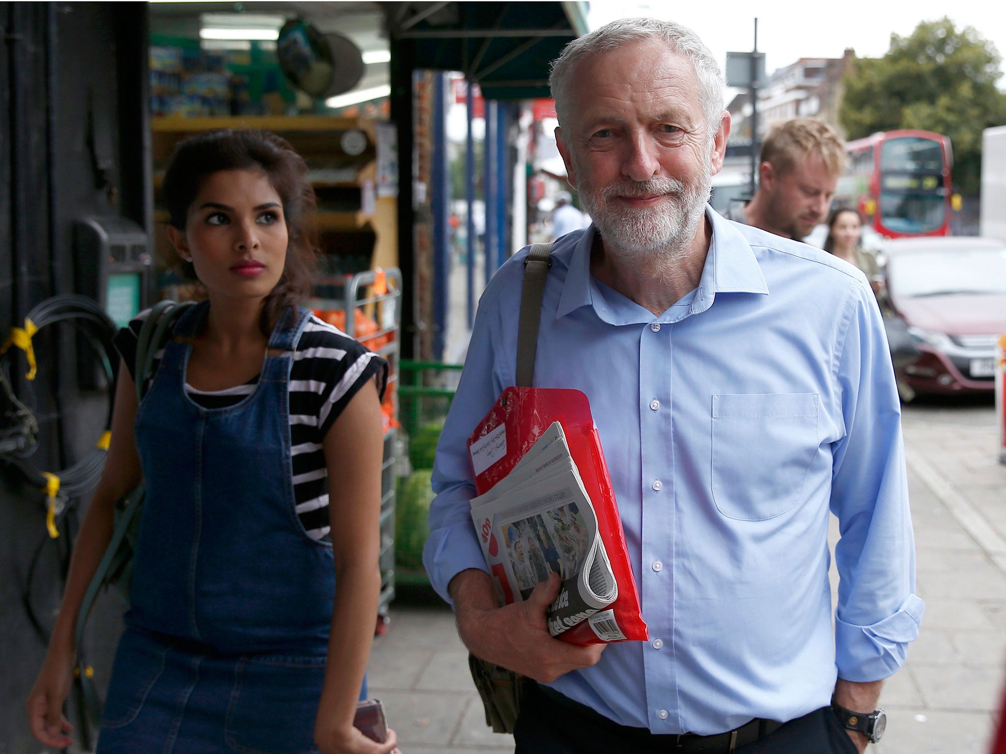 Jeremy Corbyn, walks in his constituency, following the result of the High Court challenge over Labour's leadership contest