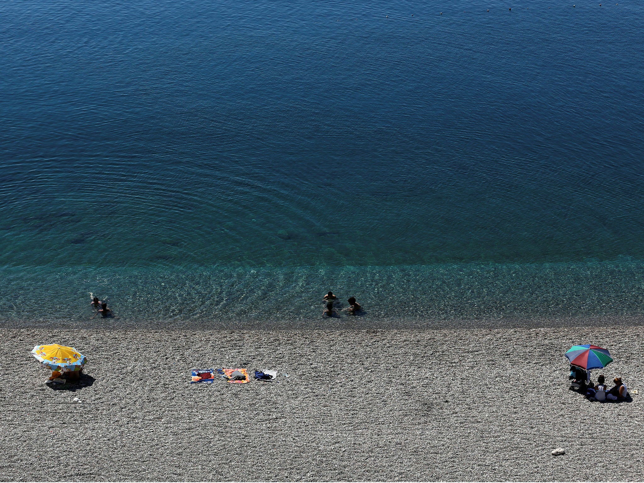 Tourists enjoy a beach in the Mediterranean resort city of Antalya, a popular destination for German tourists, in Turkey, July 25, 2016