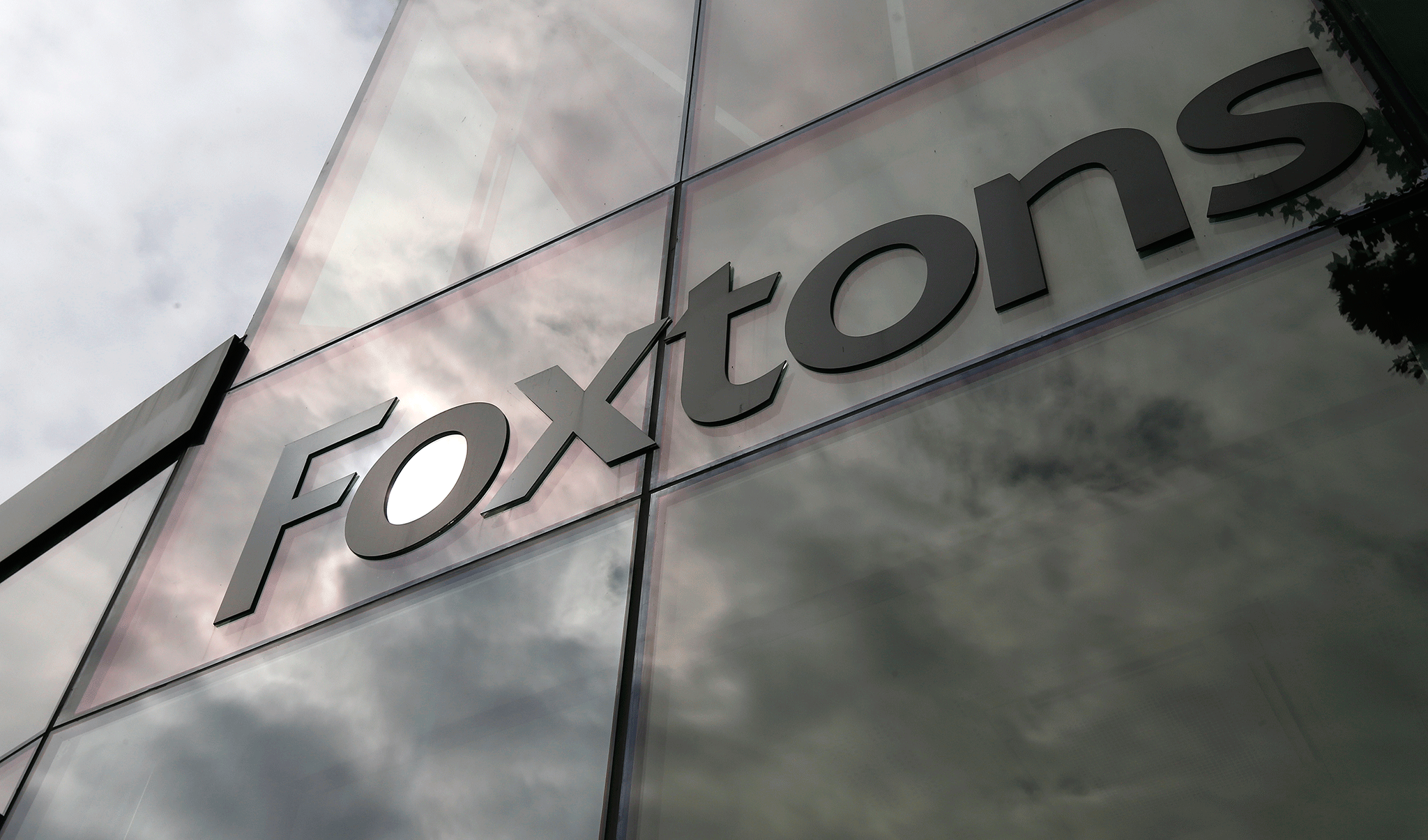 Foxtons has put its expansion plans on hold after a slowdown in London's property market