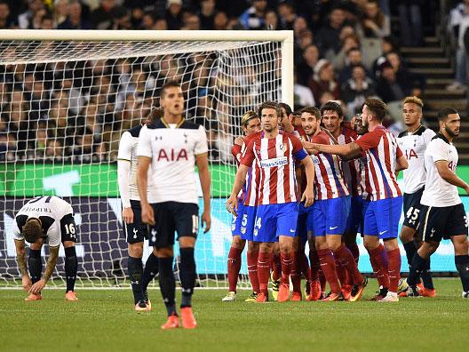 Atletico Madrid players celebrate Diego Godin's goal in Melbourne on Friday (Getty)