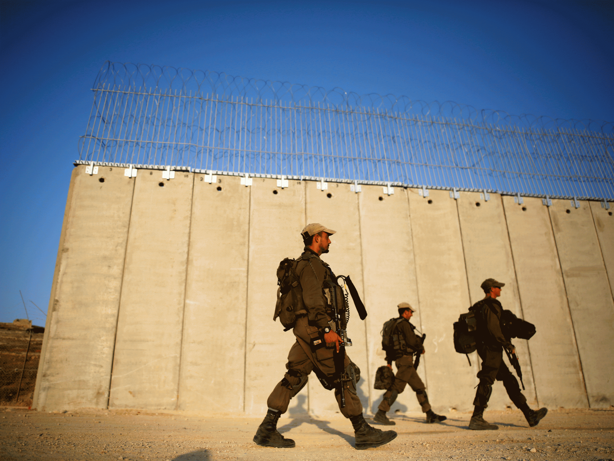 Israeli soldiers at construction on the West Bank. Palestinian minors have been held without trial in both the Russian Compound detention centre in Jerusalem and Ofer Prison in the West Bank