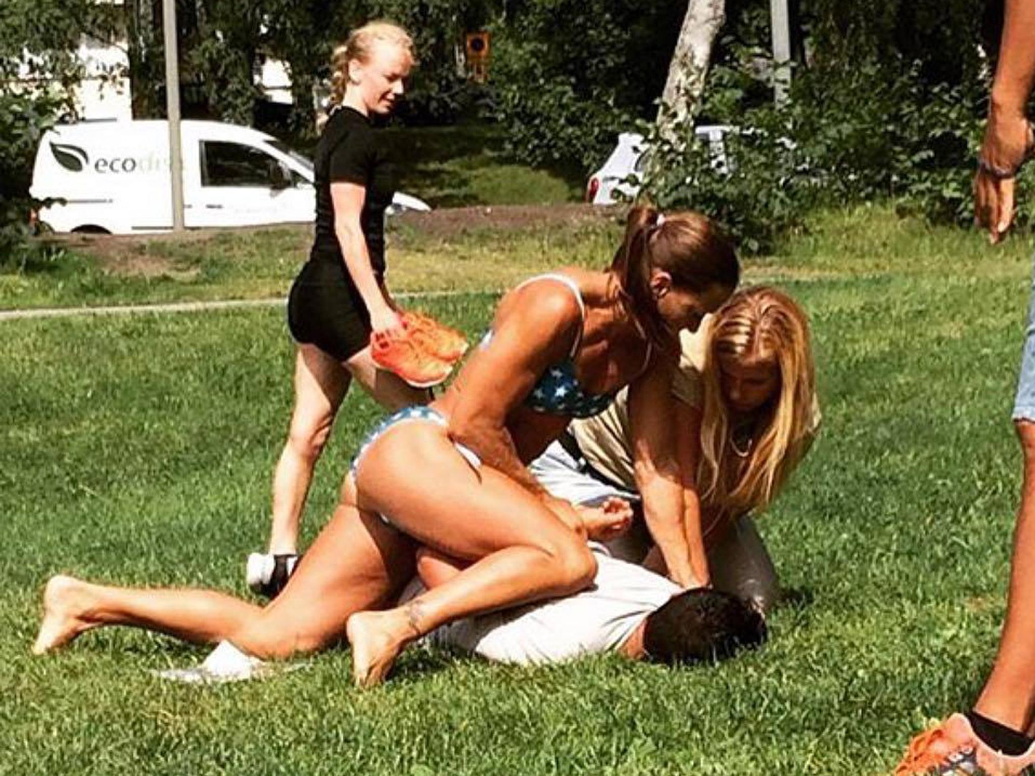 Swedish police officer Mikaela Kellner pins down a man suspected of stealing a friend's mobile phone