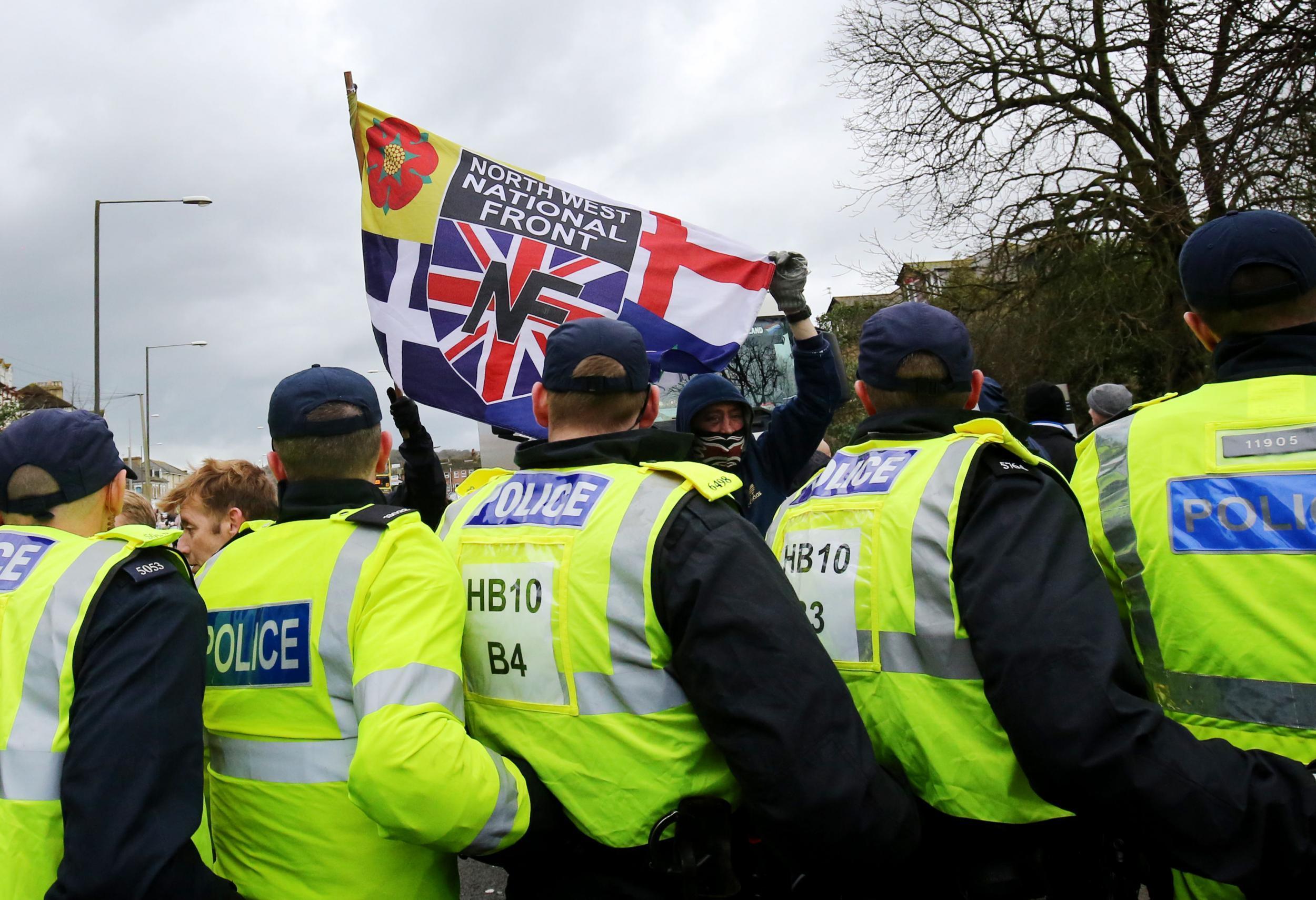 Police hold back far-right protesters at a demonstration