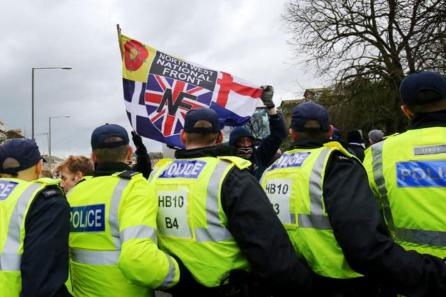Police hold back far-right protesters at a demonstration