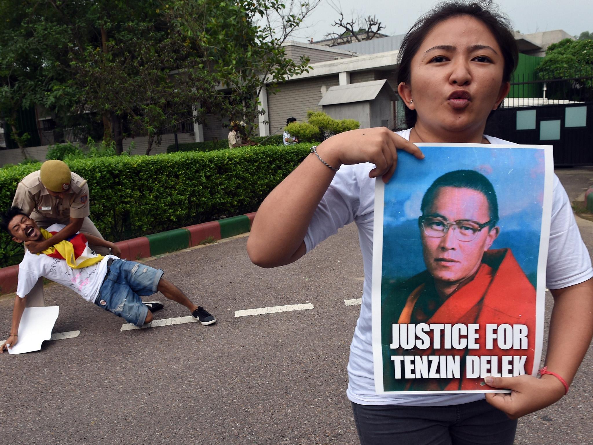 Protesters in India are arguing that the Buddhist monk was killed by prison guards