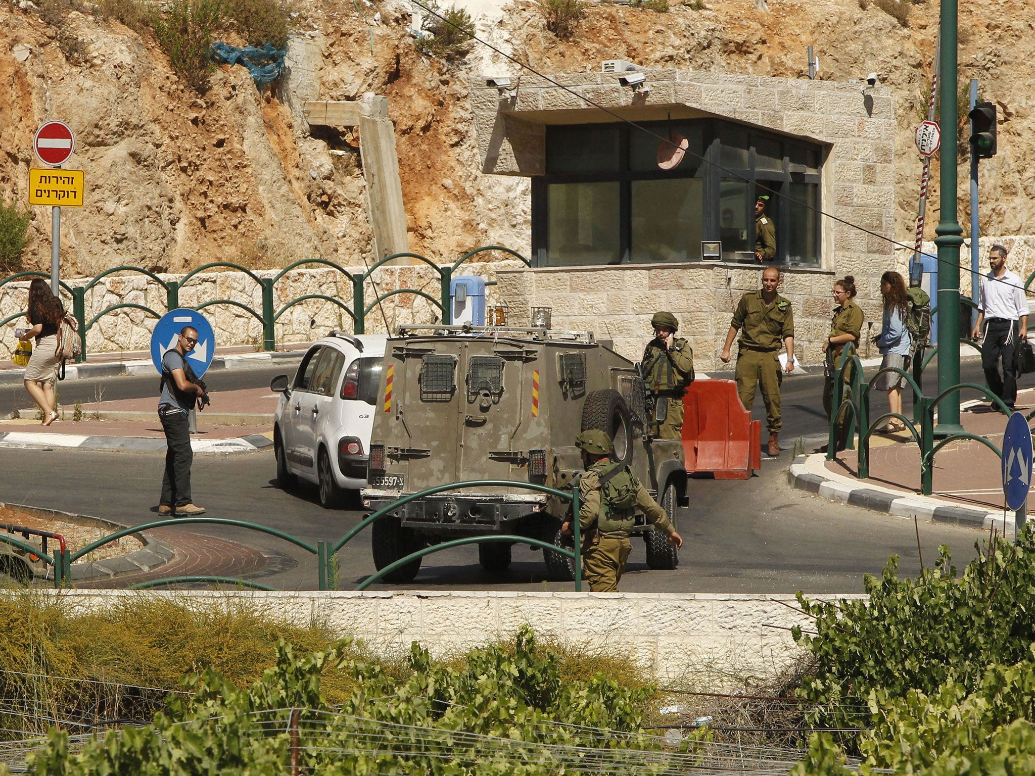 &#13;
Israeli security forces gather at the Jewish settlement of Kiryat Arba last month, after a 13-year-old Israeli girl was fatally stabbed in her bedroom (AFP/Getty)&#13;