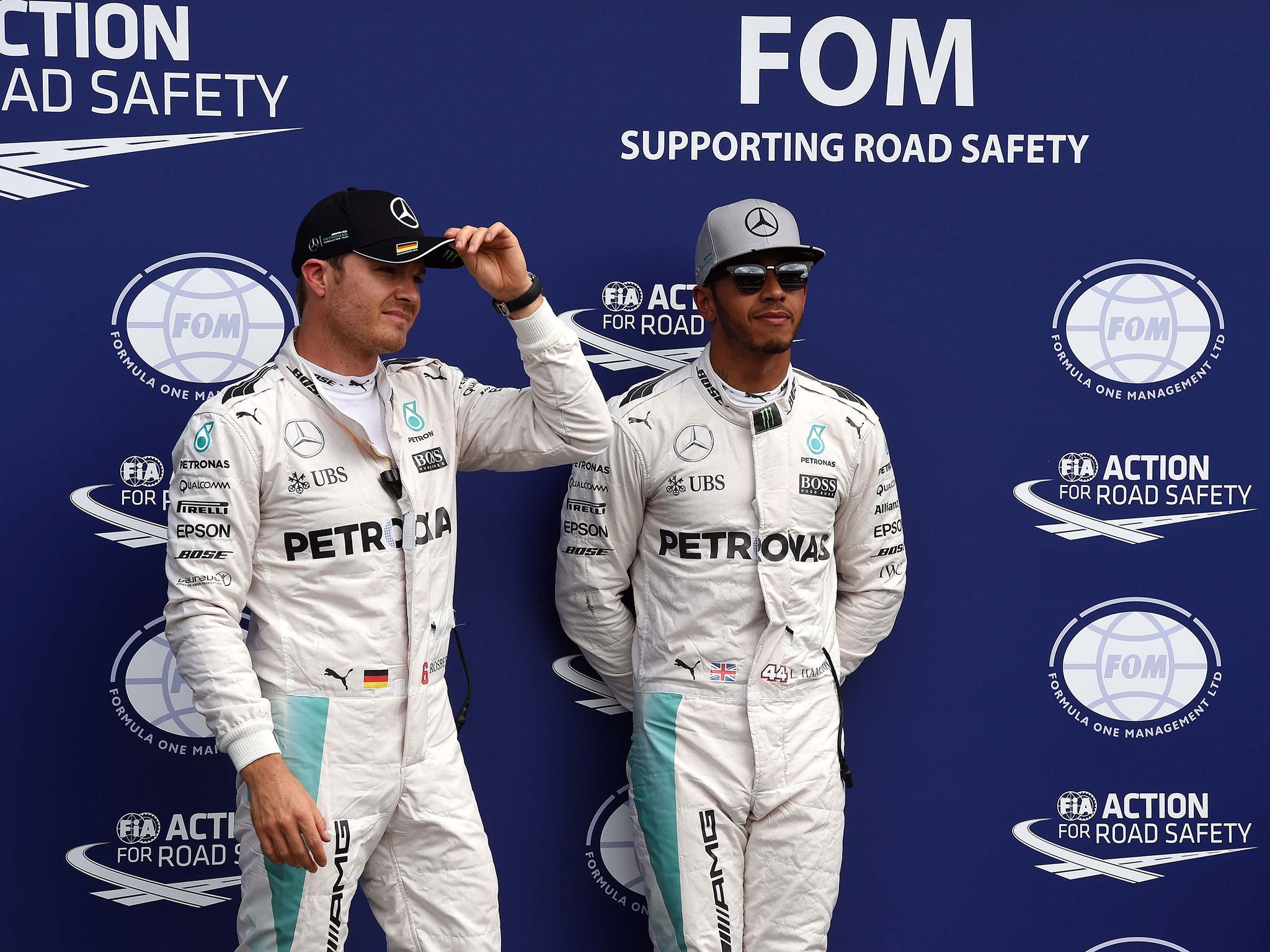 Lewis Hamilton looked tense standing next to Nico Rosberg after handing his teammate pole position
