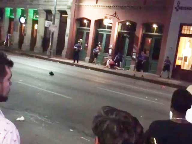People gather near the scene of the shooting in downtown Austin, Texas