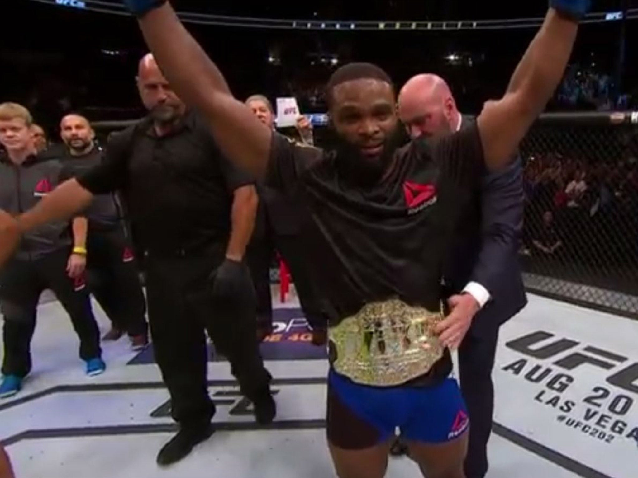 Tyron Woodley celebrates winning the UFC welterweight title after knocking out Robbie Lawler
