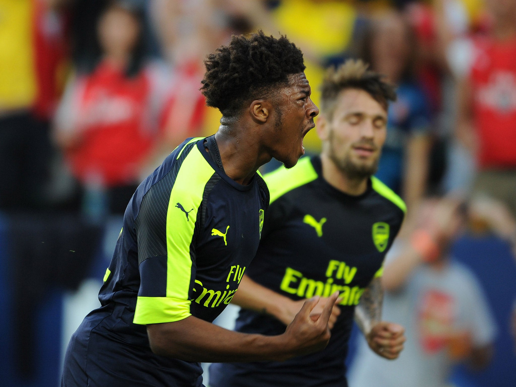 Chuba Akpom celebrates netting Arsenal's third goal