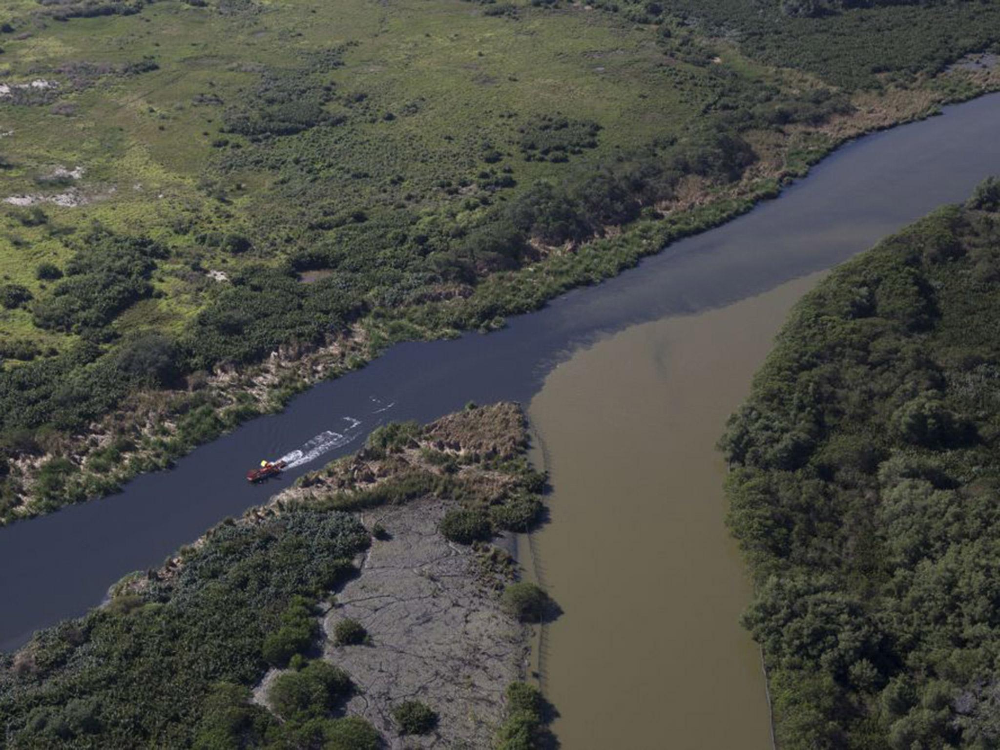 Sewage polluting a canal that rims Barra de Tijuca near the Olympic Park