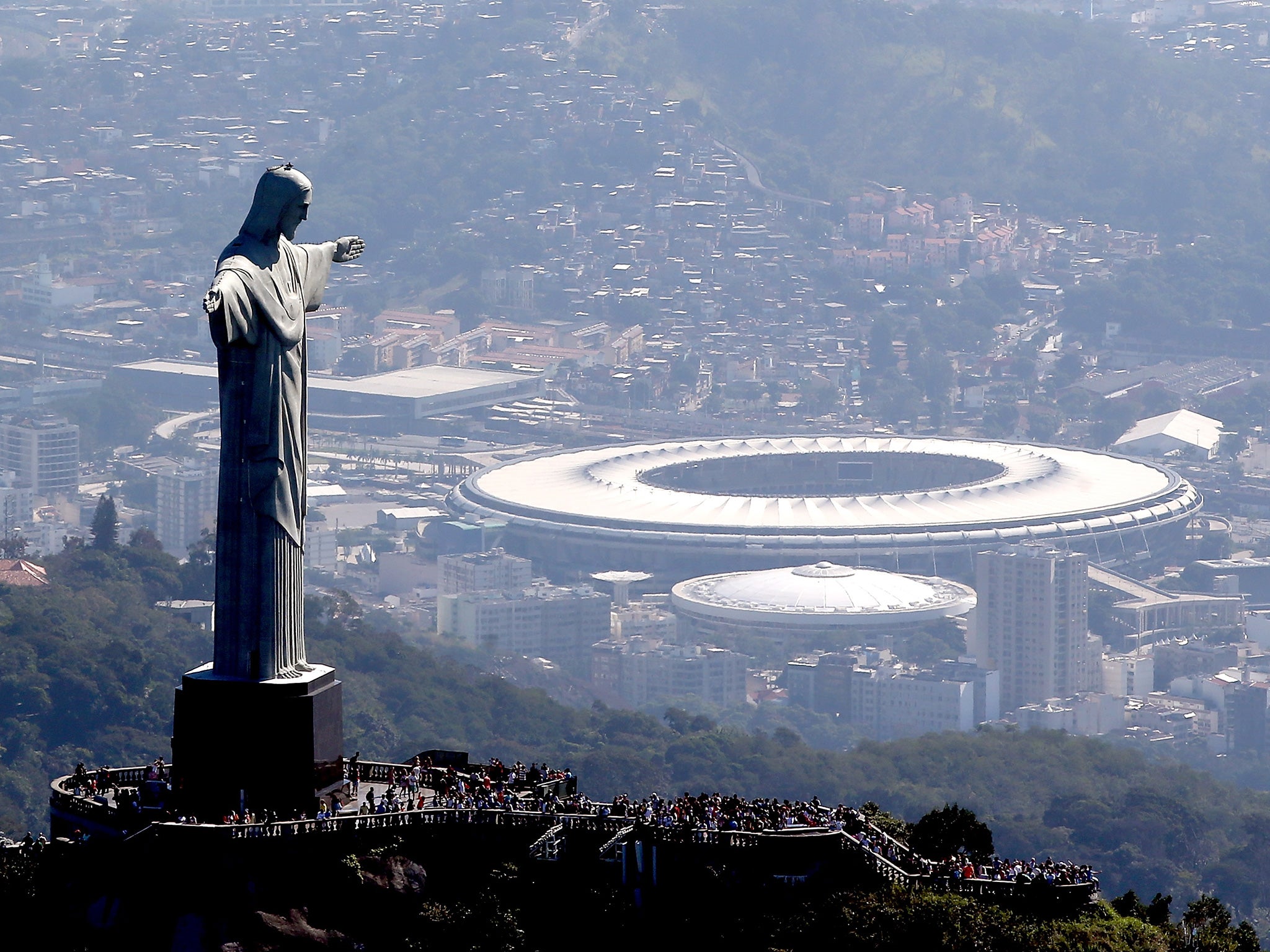 Christ the Redeemer stands over the Maracana stadium in Rio. ‘The first event should be a mosquito race, guaranteeing gold for Brazil’