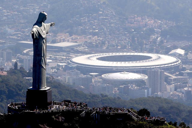 Christ the Redeemer stands over the Maracana stadium in Rio. ‘The first event should be a mosquito race, guaranteeing gold for Brazil’