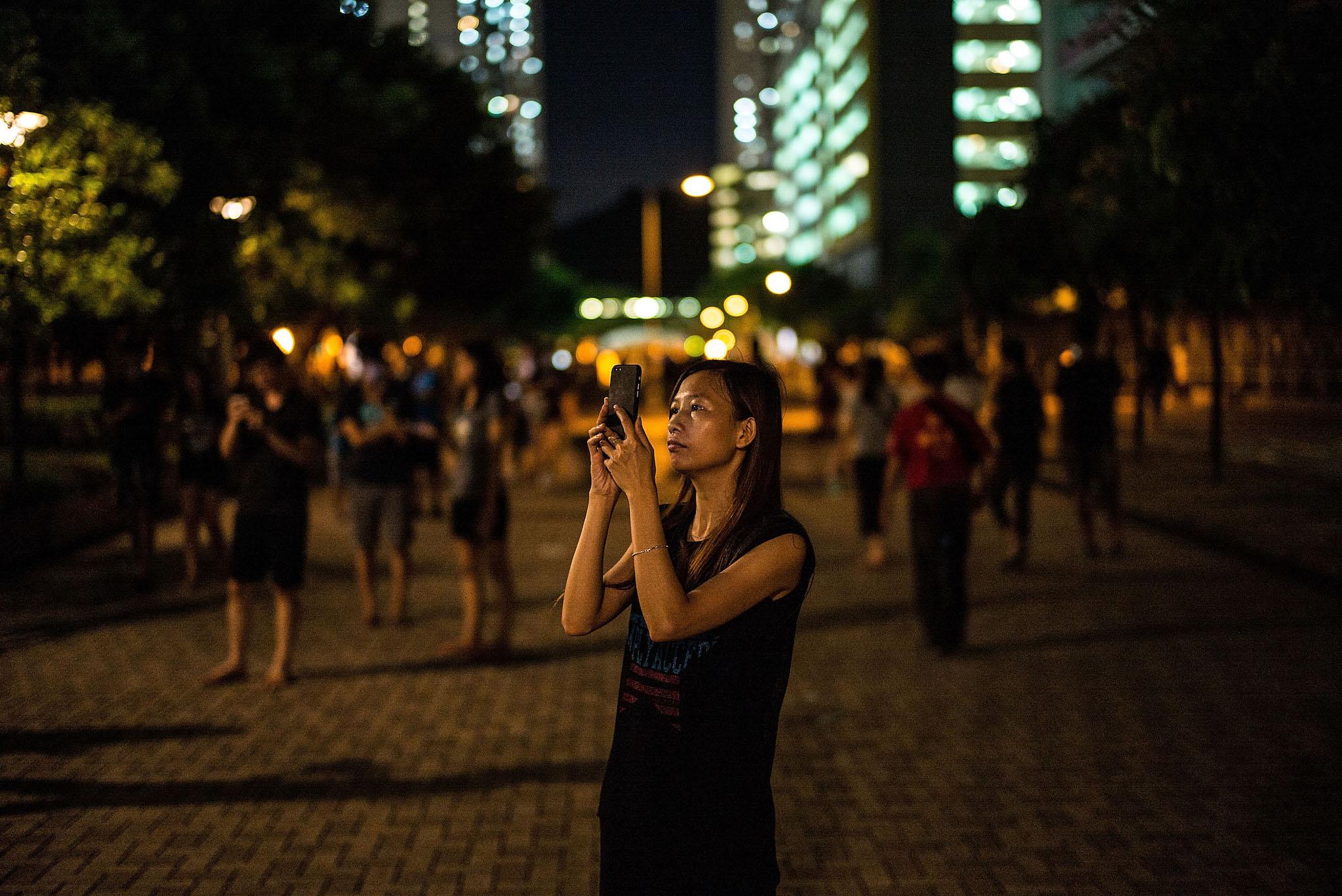 People play the Pokemon Go game at a park at Tin Shui Wai on July 26, 2016 in Hong Kong