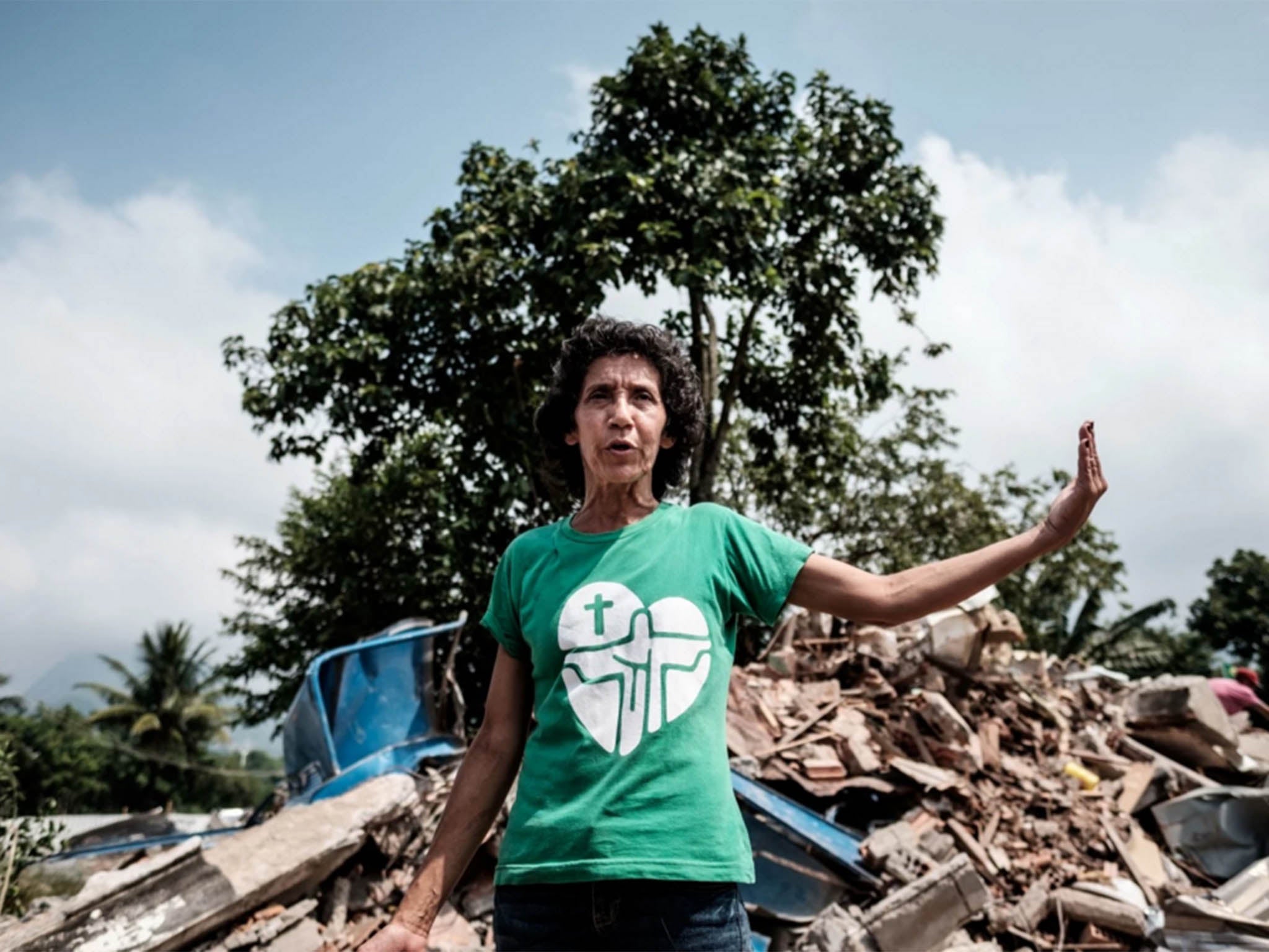 Maria da Penha Macena speaks after her house in Rio de Janeiro’s Vila Autodromo, near the Olympic Park, was demolished March 8. She and her family have since moved into three of 20 bungalows the city built for the few who held out against eviction