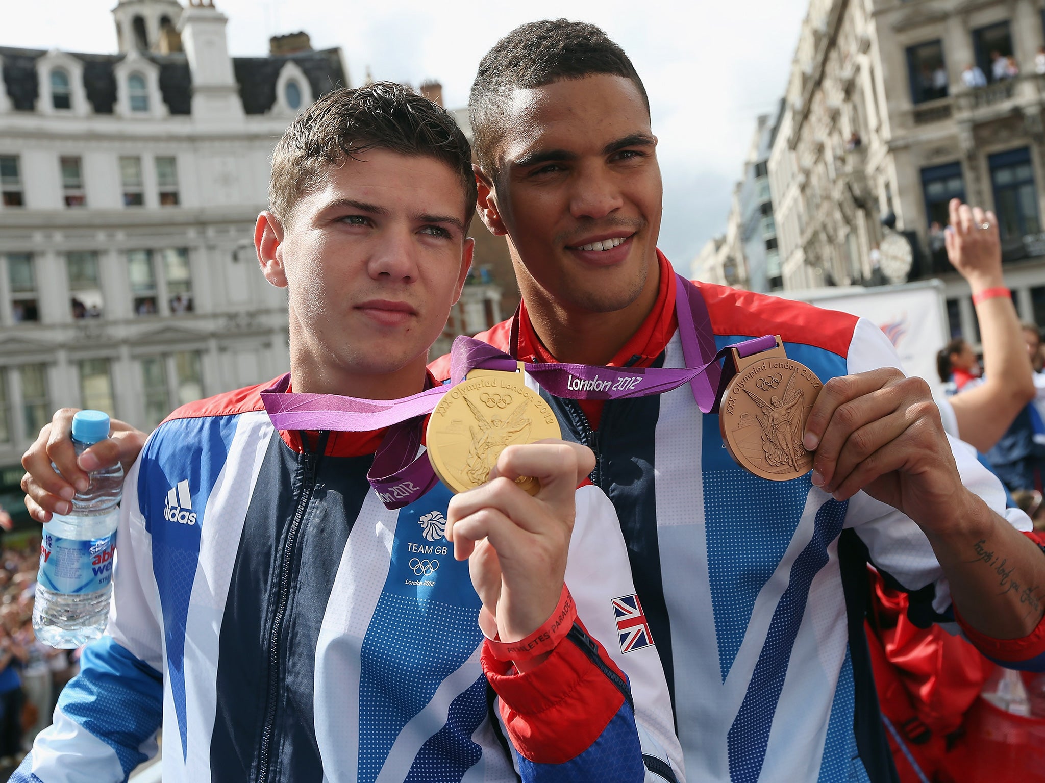 Campbell and Ogogo pose with their gold medals on the 2012 victory parade