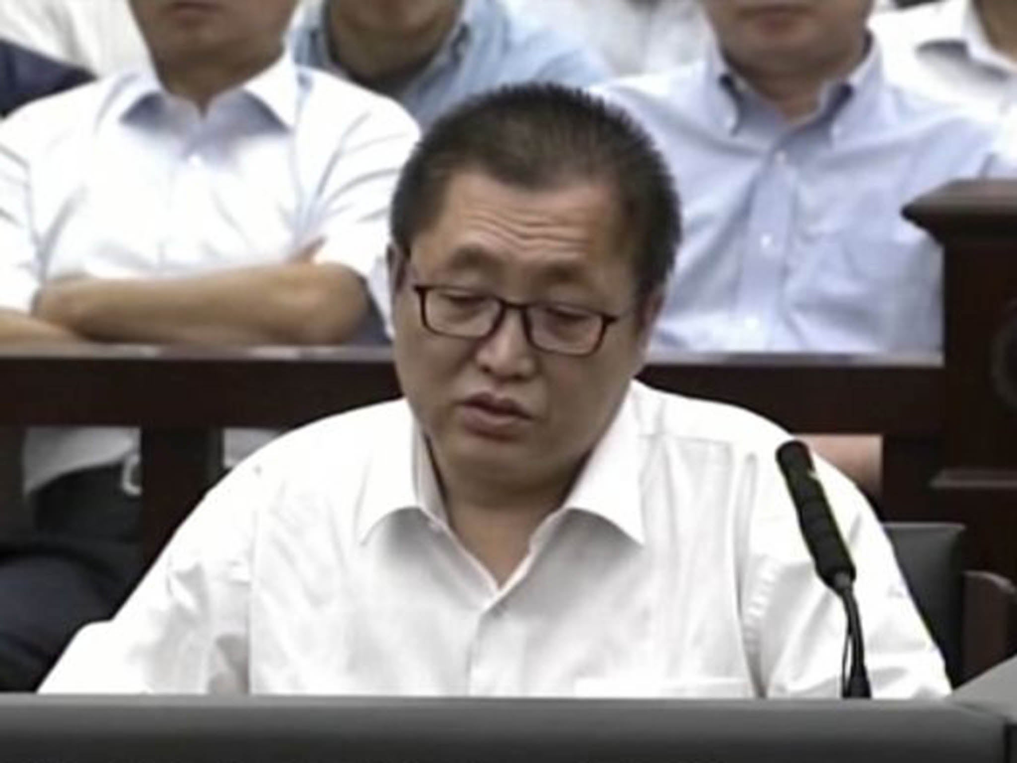 Zhai Yanmin speaks during his trial at the Tianjin No. 2 Intermediate People's Court in northern China's Tianjin Municipality
