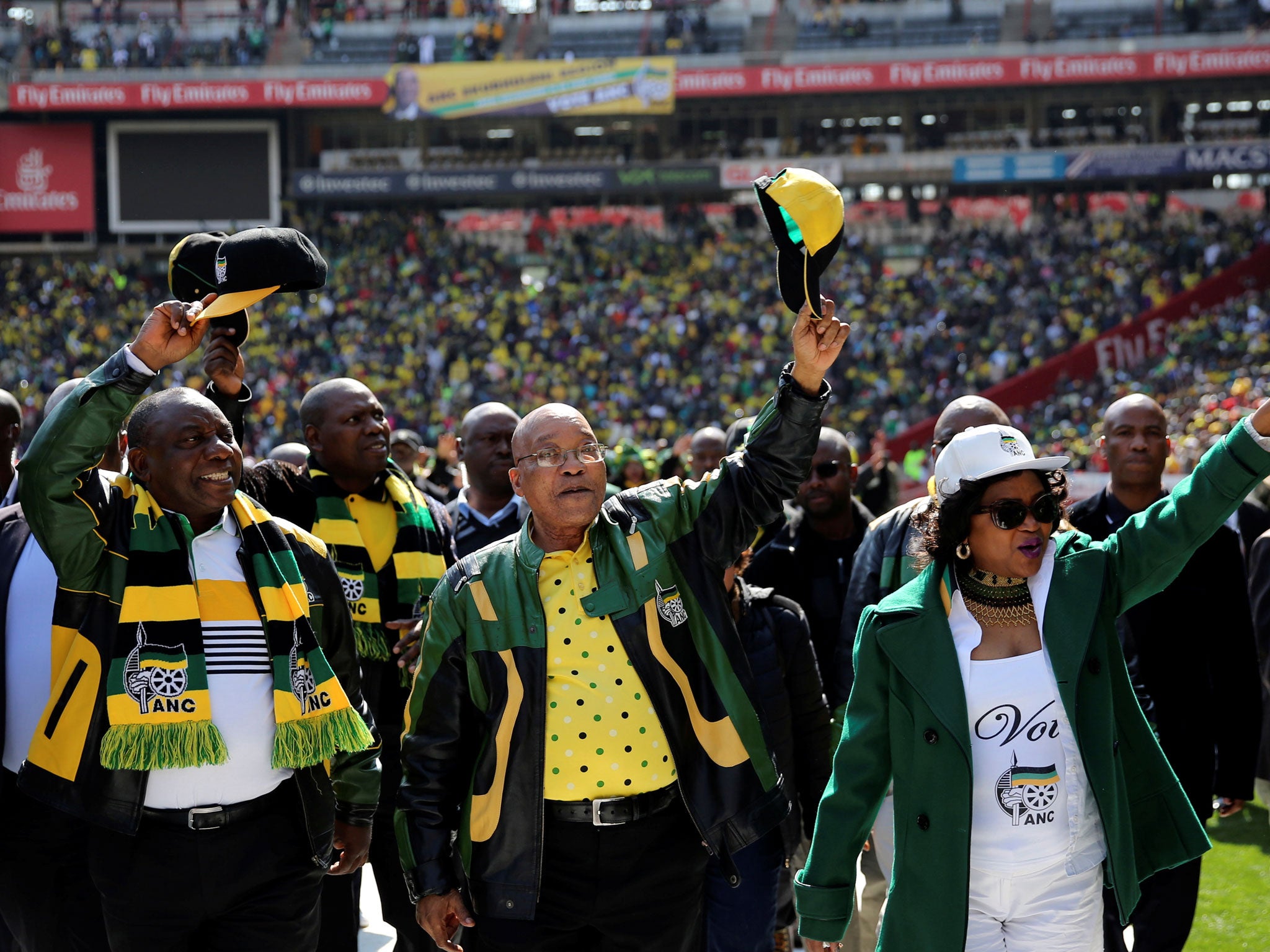 &#13;
President Jacob Zuma, centre, waves to his supporters as he arrives for the ANC traditional Siyanqoba rally ahead of the elections &#13;