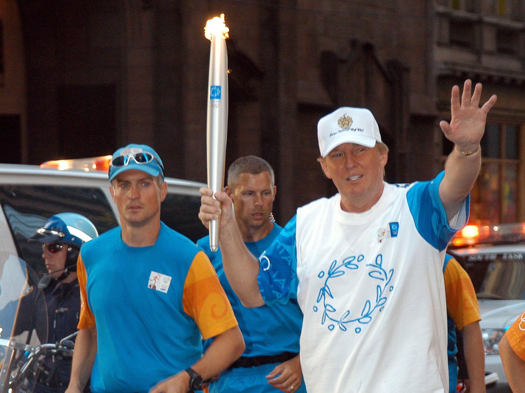 Trump carries the torch in New York prior to the 2004 Olympics in Athens Bryan Bedder/Getty