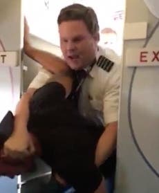 Heroic American Airlines pilot yells 'don’t put your hands on my flight attendant' before tackling passenger