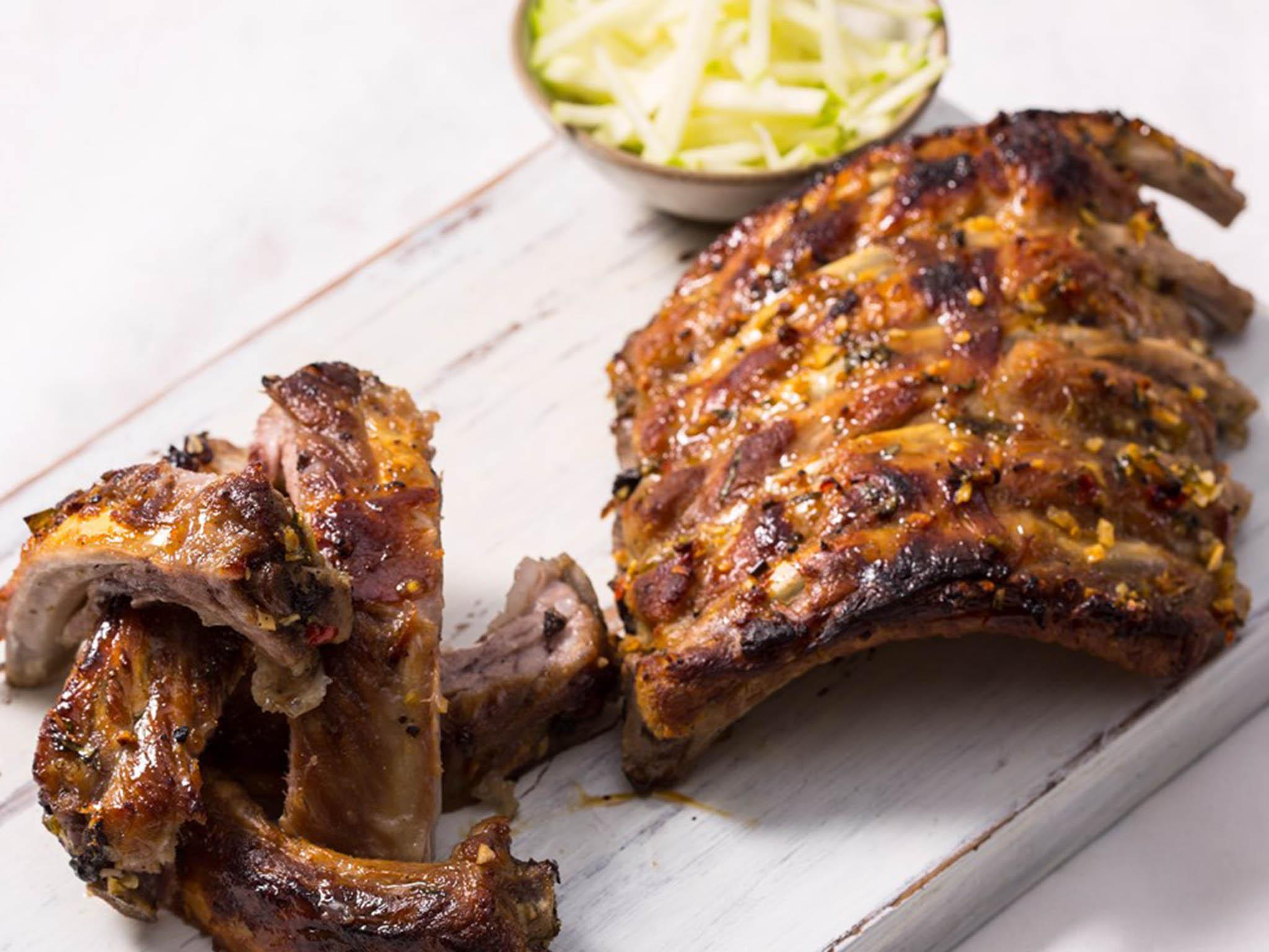 Barbecued ribs are cooked with garlic, ginger and lime and served sticky