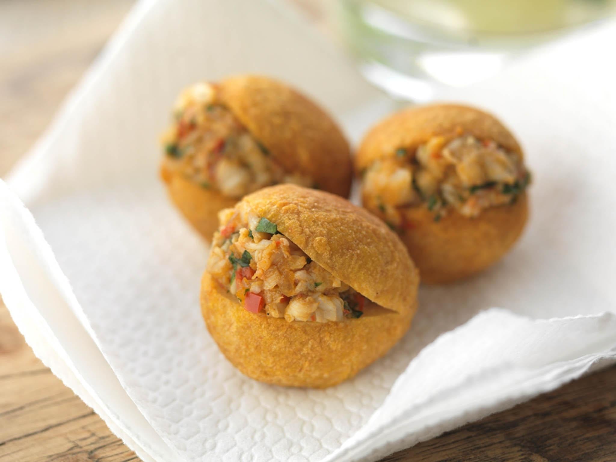 Deriving from an African infleunce, acarajé balls are stuffed with spicy fillings