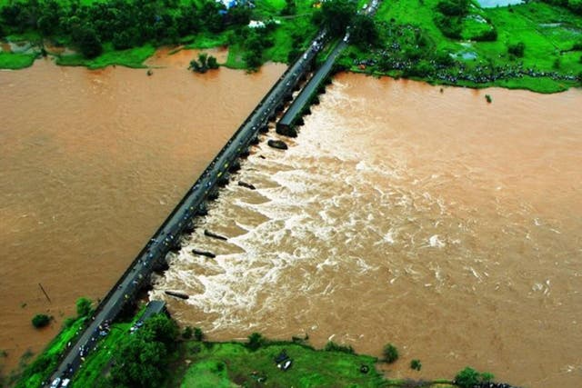 The old bridge on the Mumbai-Goa highway collapsed in a flooded river in western Maharashtra state in India around midnight on Tuesday, 2 August, 2016