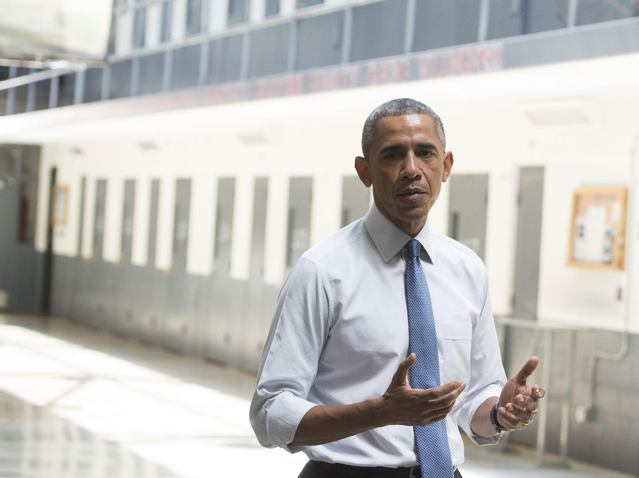 Obama speaks to reporters during a tour of an Oklahoma prison in July Saul Loeb/Getty
