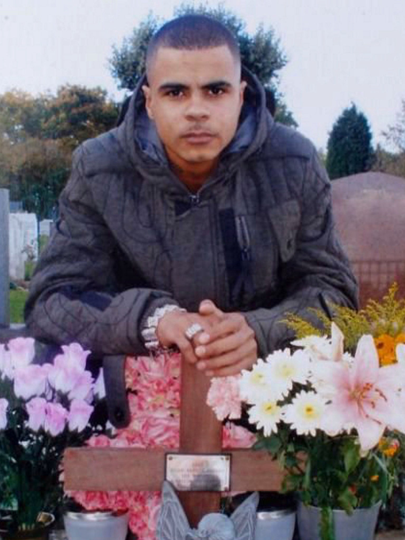Mark Duggan at his daughter’s grave in Enfield cemetery, before his death in 2011