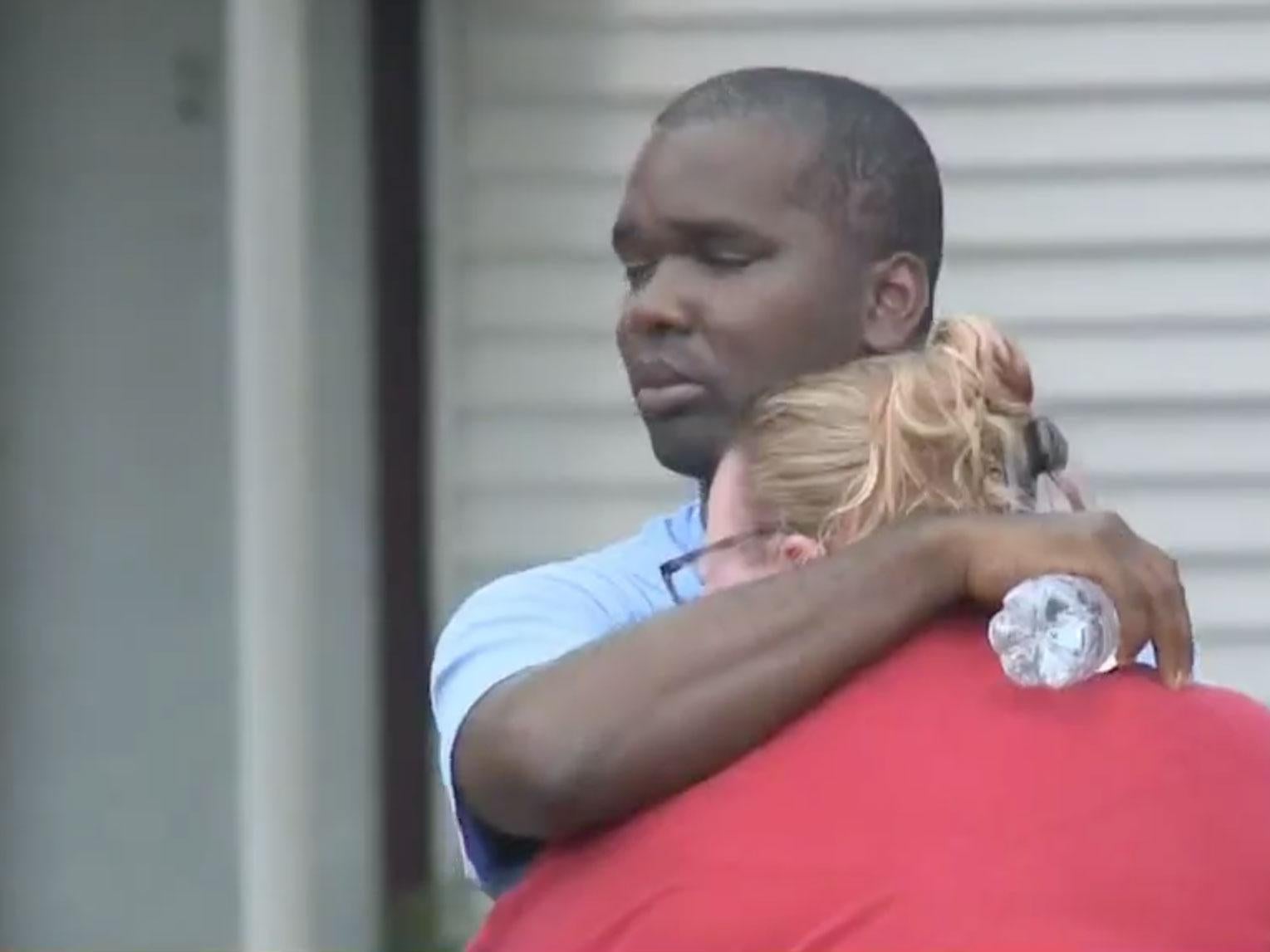 Kenneth Walker comforts his wife, Amanda, in aftermath of fire WGRZ