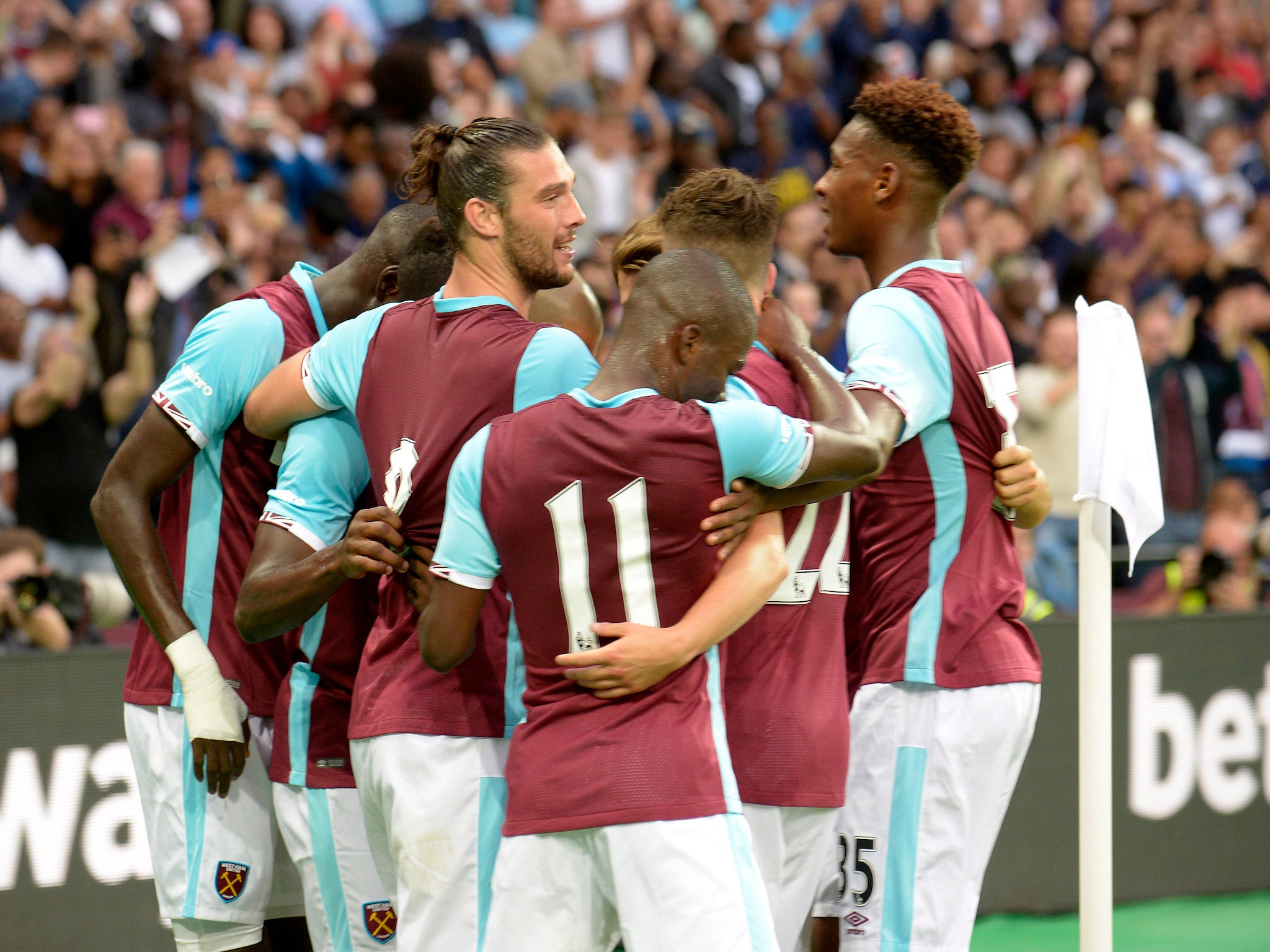 Cheikhou Kouyate is congratulated by his West Ham team-mates