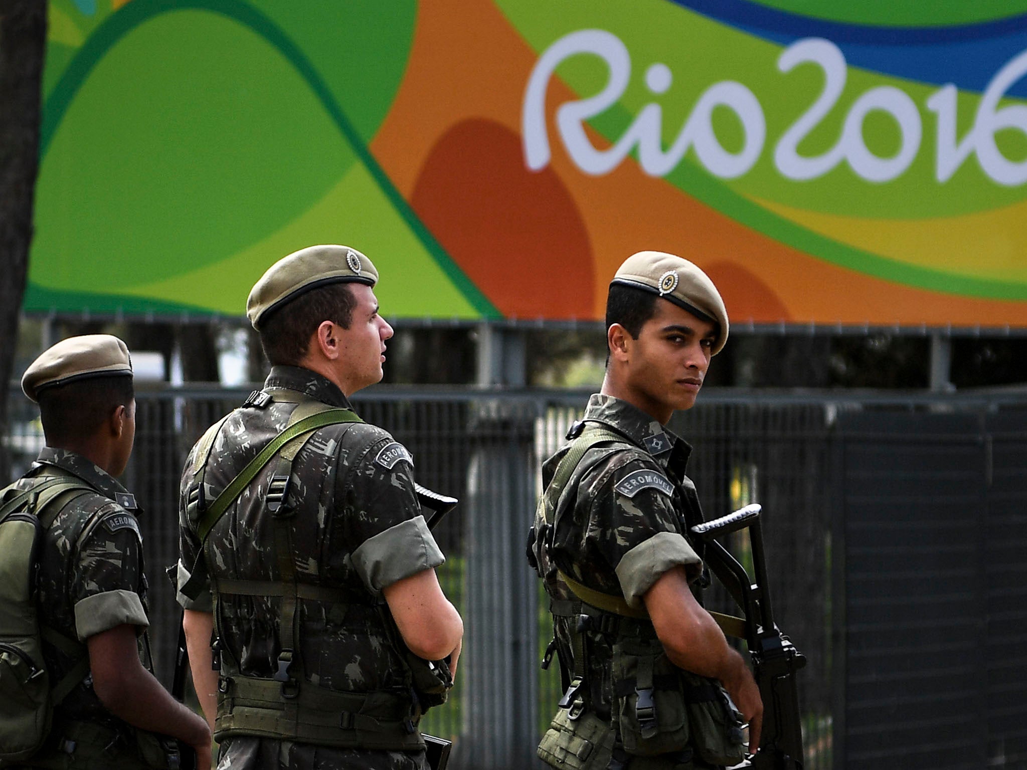 Soldiers stand guard outside the Olympic Athletes' village in Rio de Janeiro
